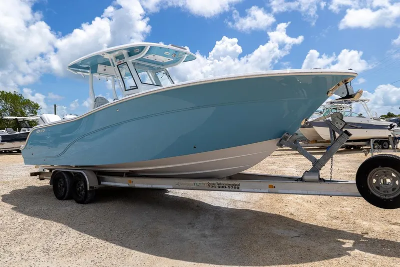  Yacht Photos Pics 2026 Sea Fox 288 Commander boat on trailer under a bright blue sky.