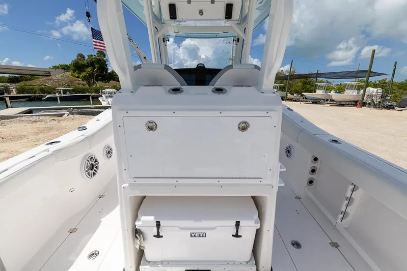  Yacht Photos Pics 2026 Sea Fox 288 Commander boat interior with Yeti cooler, docked under blue sky.