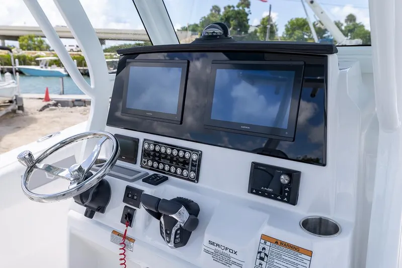  Yacht Photos Pics Helm of 2026 Sea Fox 288 Commander with dual screens and modern controls.