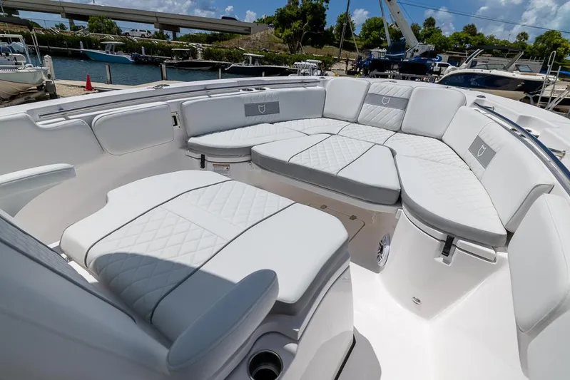  Yacht Photos Pics 2026 Sea Fox 288 Commander boat with luxurious white seating and quilted upholstery.