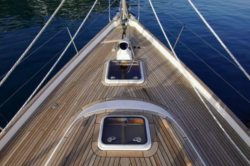Persistence Yacht Photos Pics Deck of 2002 Hallberg-Rassy 53 yacht with wooden finish and hatches.