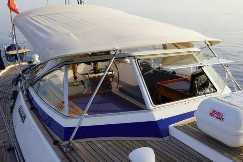 Persistence Yacht Photos Pics 2002 Hallberg-Rassy 53 yacht with covered cockpit and wooden deck.