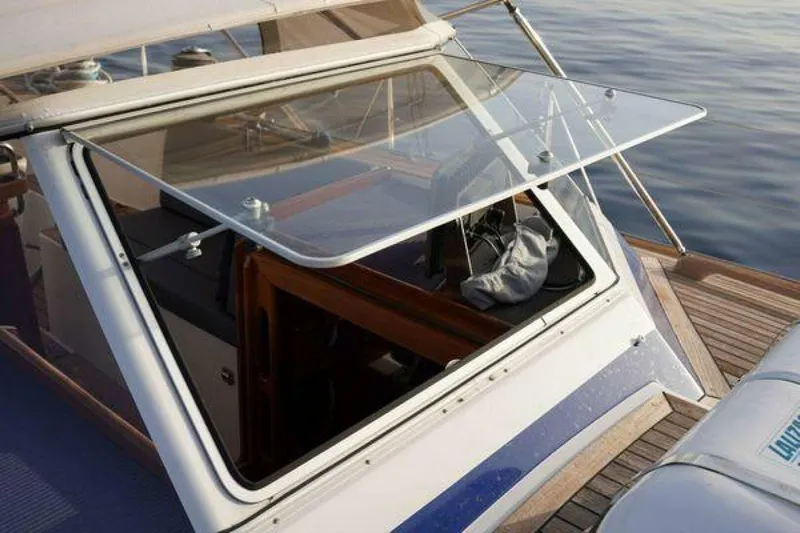 Persistence Yacht Photos Pics 2002 Hallberg-Rassy 53 yacht cockpit with open glass hatch, showcasing interior details.