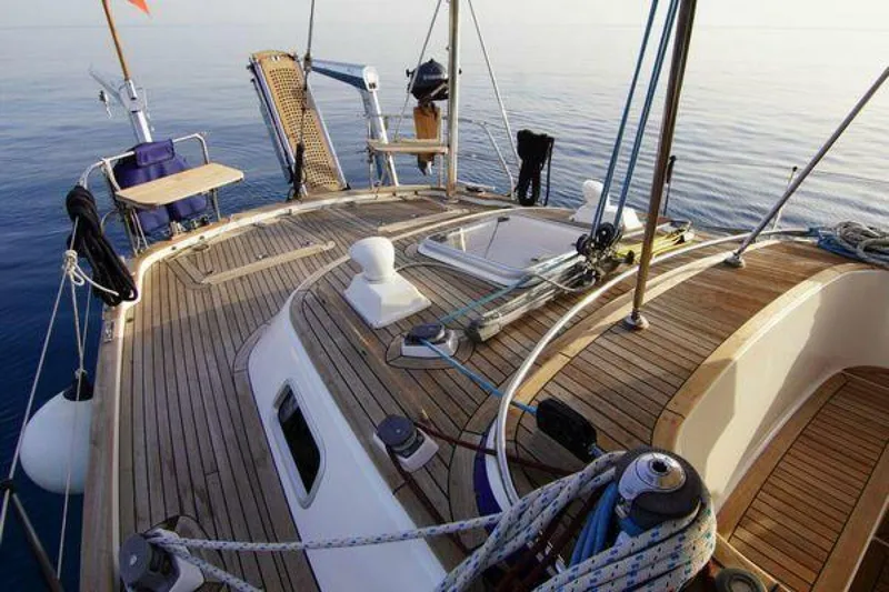 Persistence Yacht Photos Pics Deck of 2002 Hallberg-Rassy 53 yacht with wooden finish and ocean view.