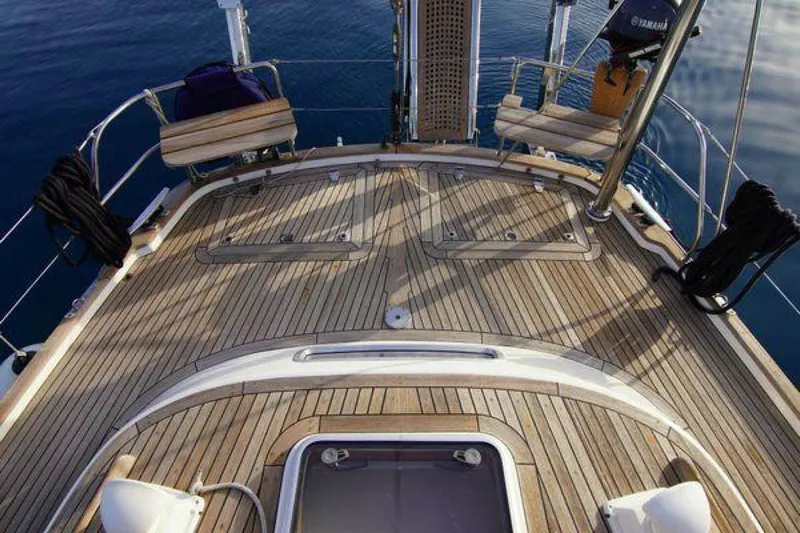 Persistence Yacht Photos Pics Deck of 2002 Hallberg-Rassy 53 yacht with teak finish and ocean view.