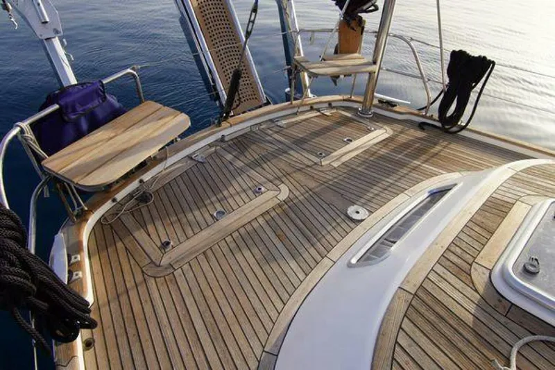 Persistence Yacht Photos Pics Teak deck of 2002 Hallberg-Rassy 53 yacht with seating and ocean view.