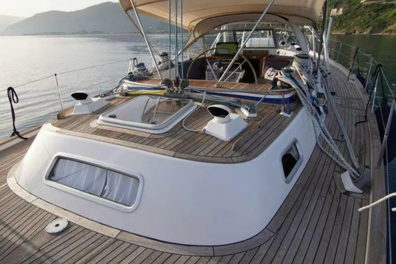 Persistence Yacht Photos Pics 2002 Hallberg-Rassy 53 sailboat deck with teak finish and ocean view.