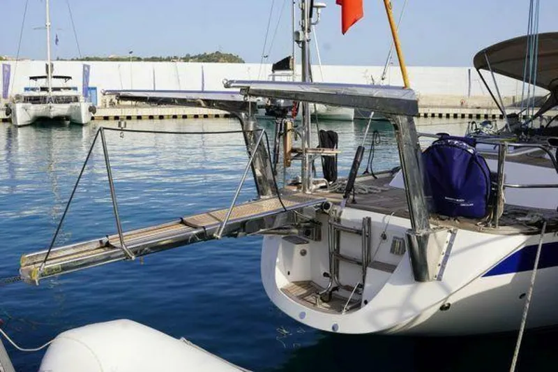 Persistence Yacht Photos Pics 2002 Hallberg-Rassy 53 yacht with extended gangway in marina setting.