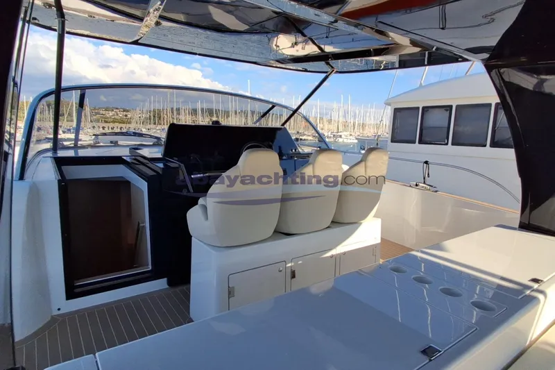  Yacht Photos Pics 2025 Solaris Power 52 Open yacht interior with helm and seating area.