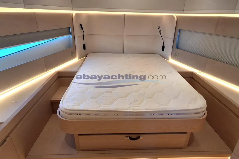  Yacht Photos Pics Luxurious cabin interior of 2025 Solaris Power 52 Open yacht with cozy bed.