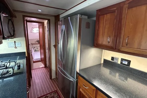 Island Hopper Yacht Photos Pics Galley kitchen in 2001 Crosswater Passagemaker 49 yacht with stainless steel appliances.
