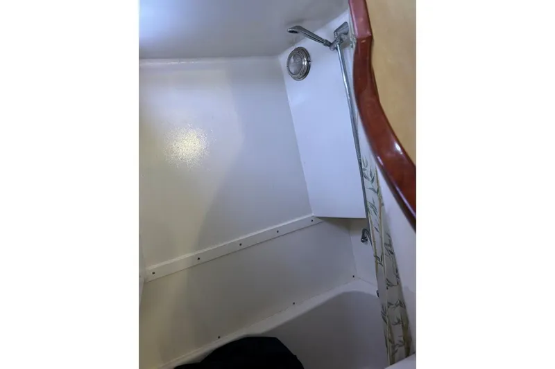 Island Hopper Yacht Photos Pics Shower area in 2001 Crosswater Passagemaker 49 boat, featuring a handheld showerhead.