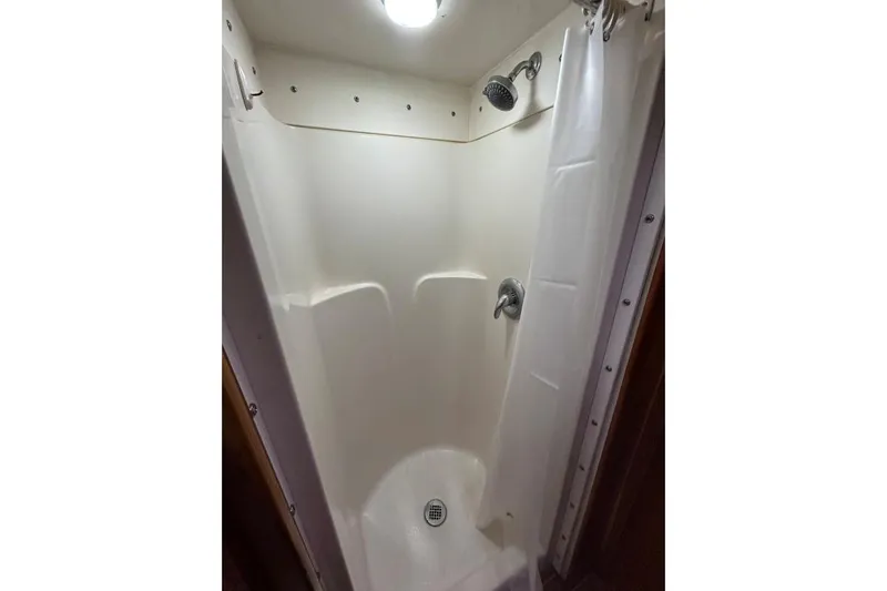 Island Hopper Yacht Photos Pics Compact shower area in 2001 Crosswater Passagemaker 49 boat.