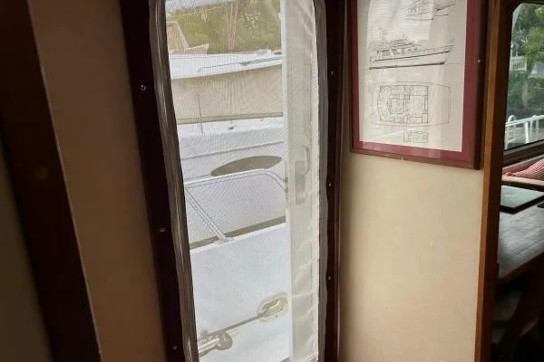 Island Hopper Yacht Photos Pics Interior view of 2001 Crosswater Passagemaker 49 with framed boat plans.