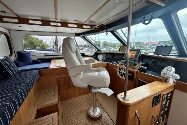 Island Hopper Yacht Photos Pics Interior of 2001 Crosswater Passagemaker 49 yacht with helm and seating area.