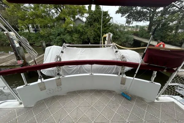 Island Hopper Yacht Photos Pics Deck view of 2001 Crosswater Passagemaker 49 yacht with covered equipment and dockside setting.