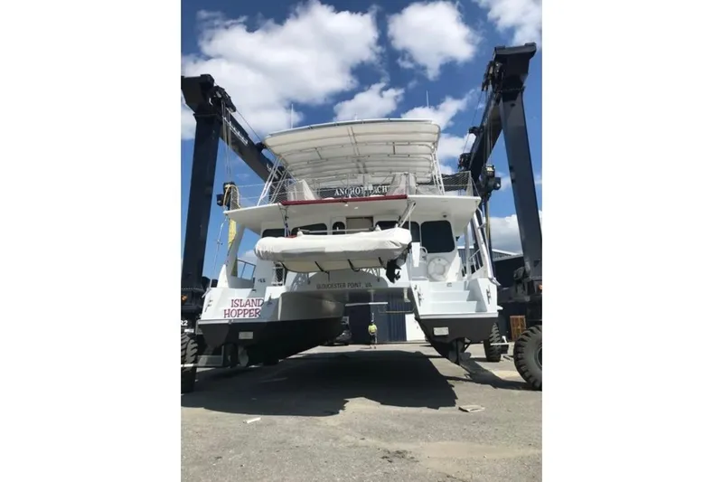 Island Hopper Yacht Photos Pics Crosswater Passagemaker 49 yacht, 2001 model, on a lift at a marina.