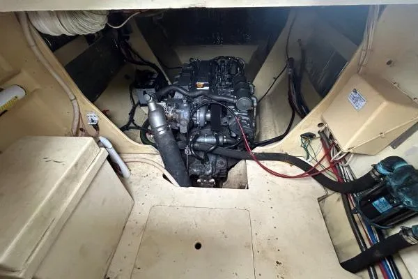 Island Hopper Yacht Photos Pics Engine room of 2001 Crosswater Passagemaker 49 with visible machinery and wiring.