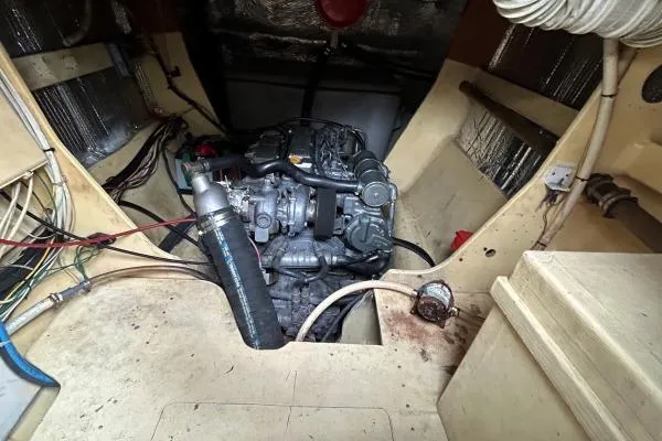 Island Hopper Yacht Photos Pics Engine room of 2001 Crosswater Passagemaker 49, showcasing mechanical components and wiring.