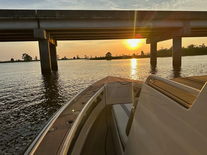  Yacht Photos Pics Custom Leblanc CC boat under bridge at sunset, 2003 model.