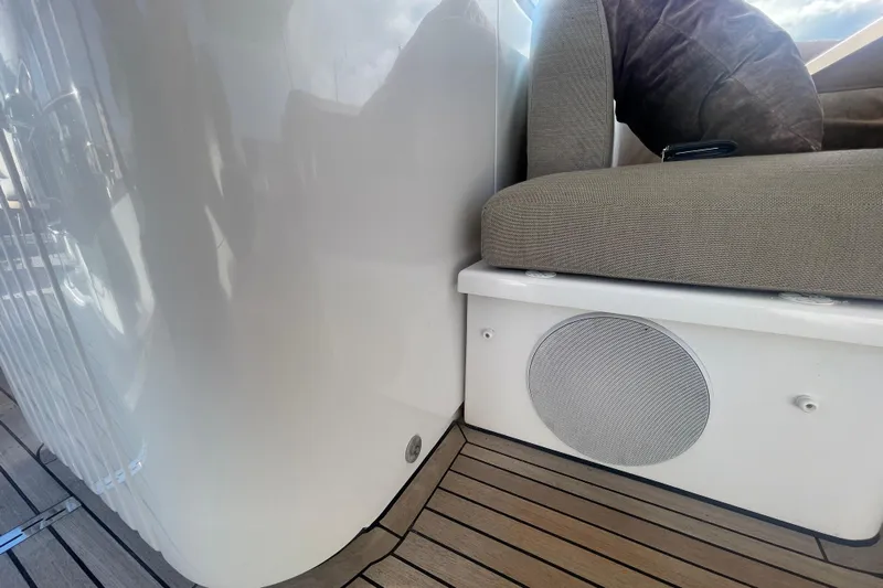 Azimut 66 Magellano Yacht Photos Pics Azimut Magellano 66 yacht interior, 2024 model, featuring cushioned seating and integrated speaker.