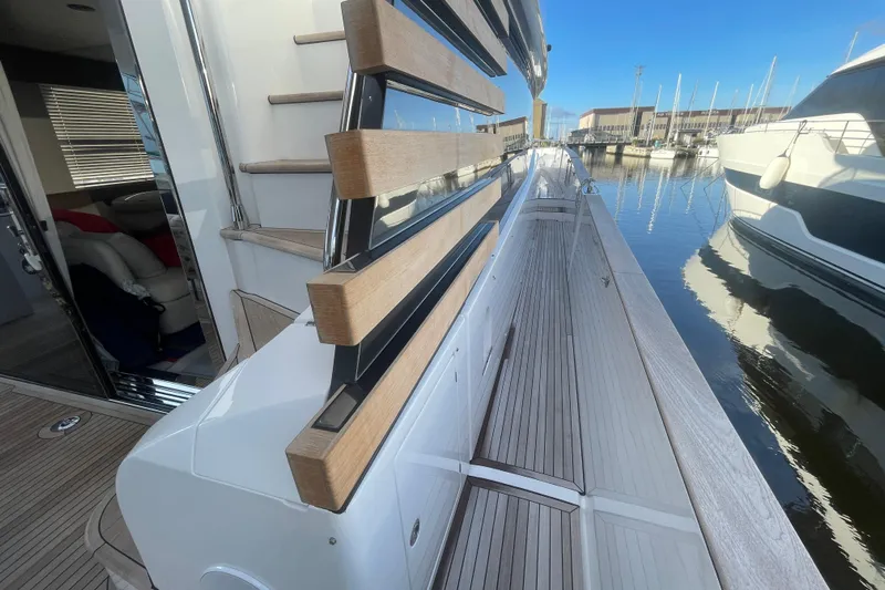 Azimut 66 Magellano Yacht Photos Pics 2024 Azimut Magellano 66 yacht deck with modern design and marina view.