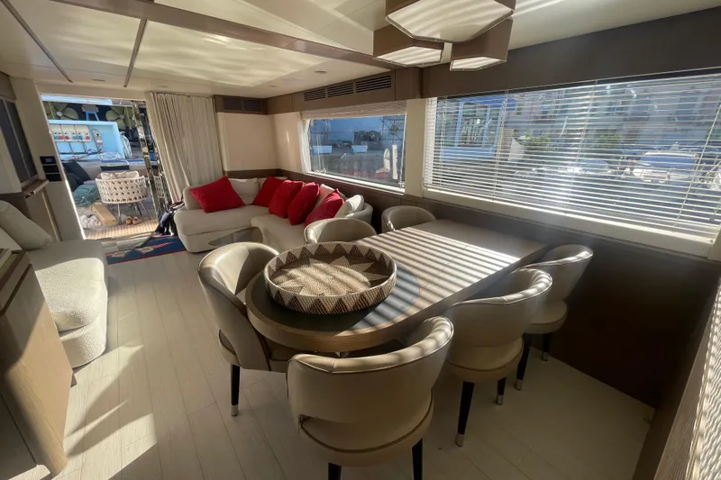 Azimut 66 Magellano Yacht Photos Pics Luxurious interior of 2024 Azimut Magellano 66 yacht with elegant dining area and plush seating.