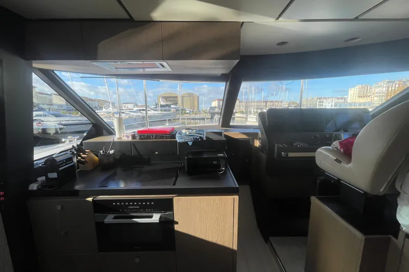 Azimut 66 Magellano Yacht Photos Pics Interior of 2024 Azimut Magellano 66 yacht with modern kitchen and helm station.