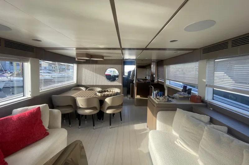 Azimut 66 Magellano Yacht Photos Pics Luxurious interior of 2024 Azimut Magellano 66 yacht with elegant seating and dining area.