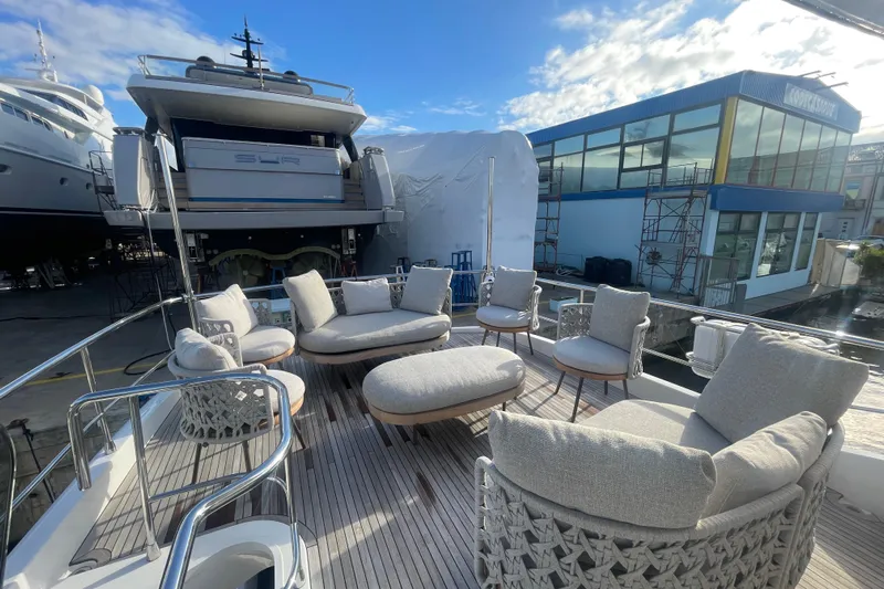 Azimut 66 Magellano Yacht Photos Pics Luxurious 2024 Azimut Magellano 66 yacht deck with elegant outdoor seating.