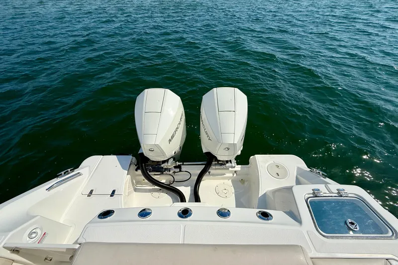  Yacht Photos Pics 2024 Boston Whaler 250 Outrage with dual Mercury outboard engines on open water.