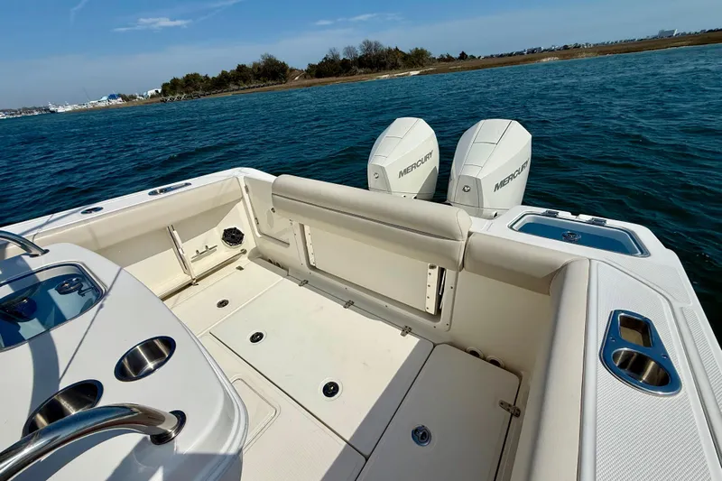  Yacht Photos Pics 2024 Boston Whaler 250 Outrage boat with dual Mercury engines on open water.