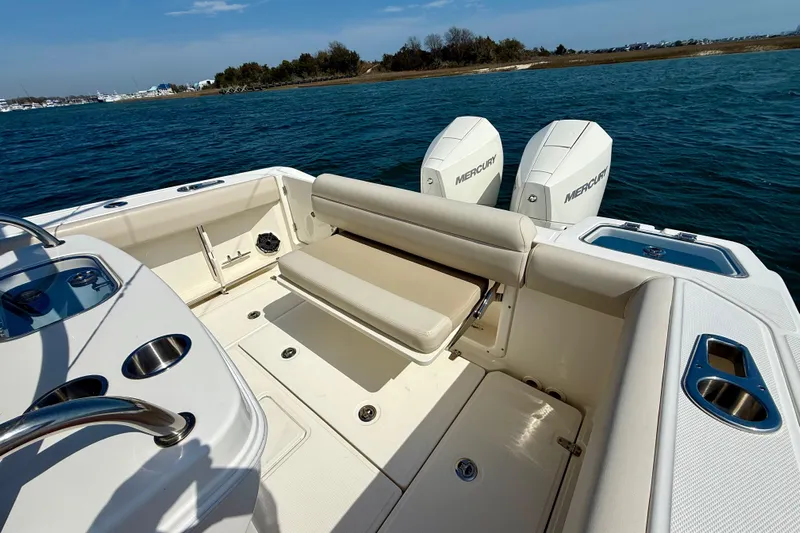  Yacht Photos Pics 2024 Boston Whaler 250 Outrage boat interior with dual Mercury engines.