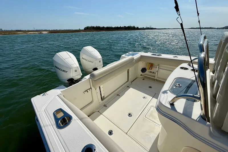  Yacht Photos Pics 2024 Boston Whaler 250 Outrage boat with dual Mercury engines on open water.