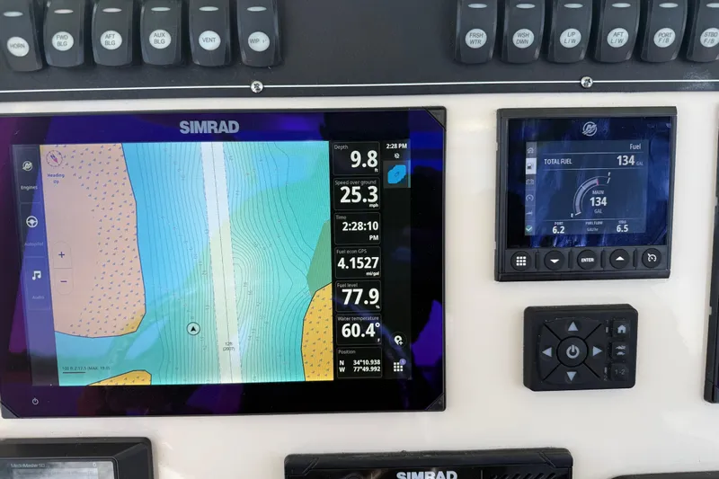  Yacht Photos Pics Dashboard of 2024 Boston Whaler 250 Outrage with Simrad navigation and fuel display.