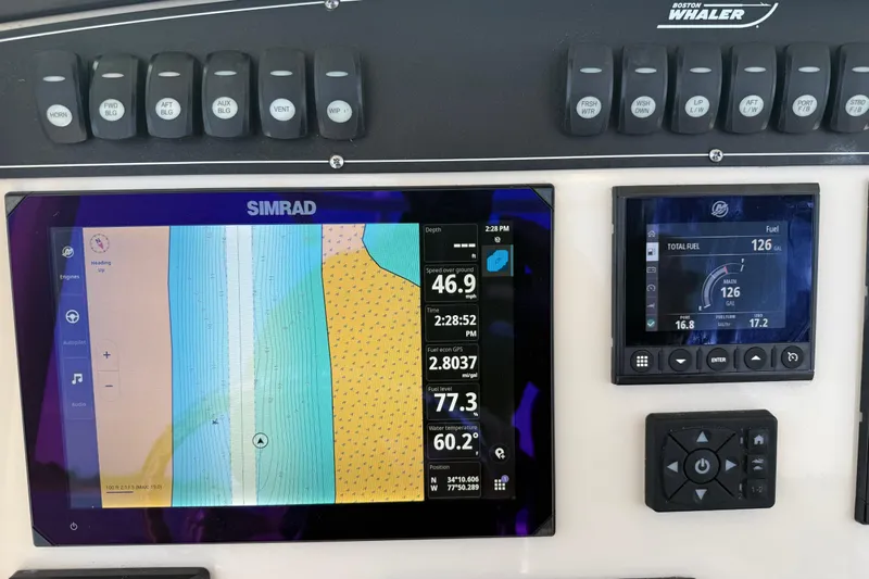  Yacht Photos Pics Control panel of 2024 Boston Whaler 250 Outrage with Simrad navigation display.