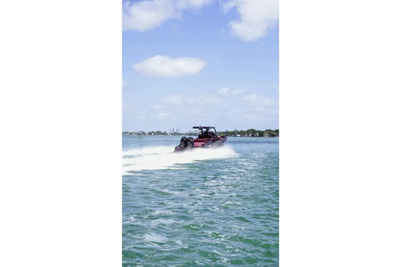  Yacht Photos Pics 2024 Skipper 42 boat cruising on a sunny day with clear blue skies.