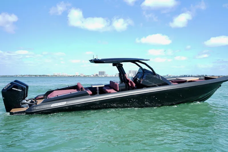  Yacht Photos Pics 2024 Skipper 42 boat on water, sleek design, sunny day, city skyline background.