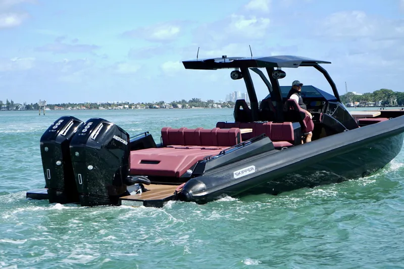  Yacht Photos Pics 2024 Skipper 42 boat cruising on water with dual engines and sleek design.
