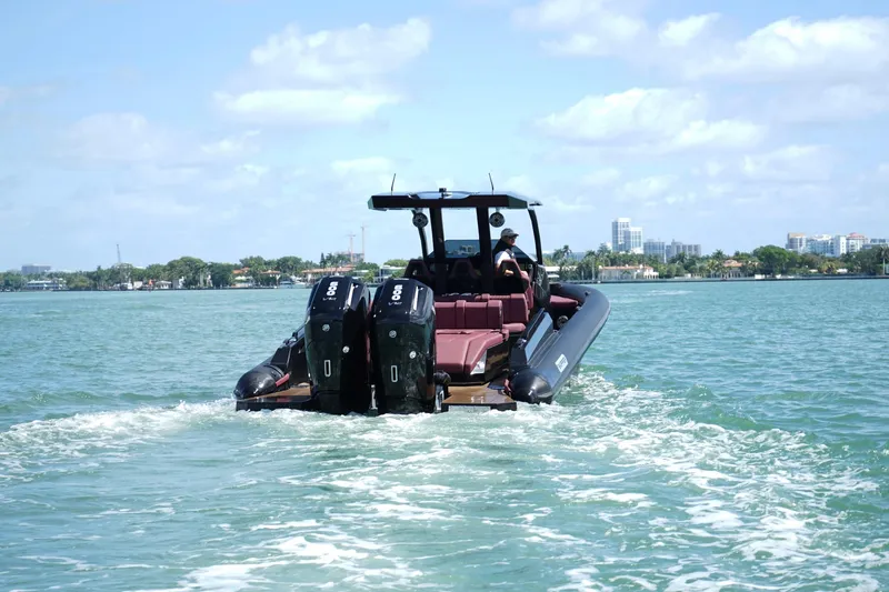  Yacht Photos Pics 2024 Skipper 42 boat cruising on a sunny day with twin outboard engines.
