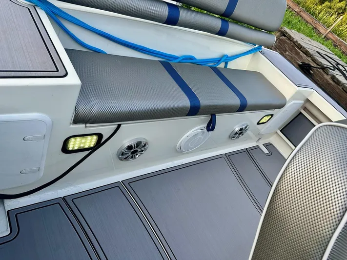  Yacht Photos Pics Interior of 2003 Custom Leblanc CC boat with cushioned seating and speakers.