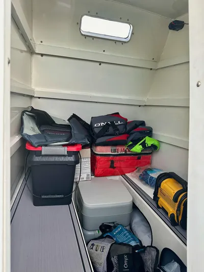  Yacht Photos Pics Interior of a 2003 Custom Leblanc CC boat with storage items and life jackets.