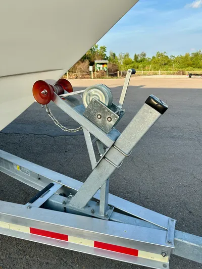  Yacht Photos Pics Trailer winch system for 2003 Custom Leblanc CC boat, featuring red rollers and metal frame.