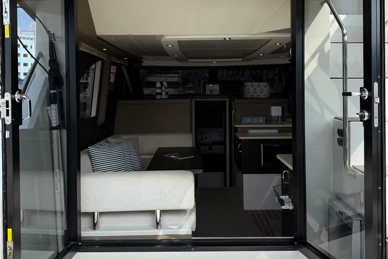 Long Gone Yacht Photos Pics Interior view of 2013 Carver C34 yacht, featuring modern seating and decor.