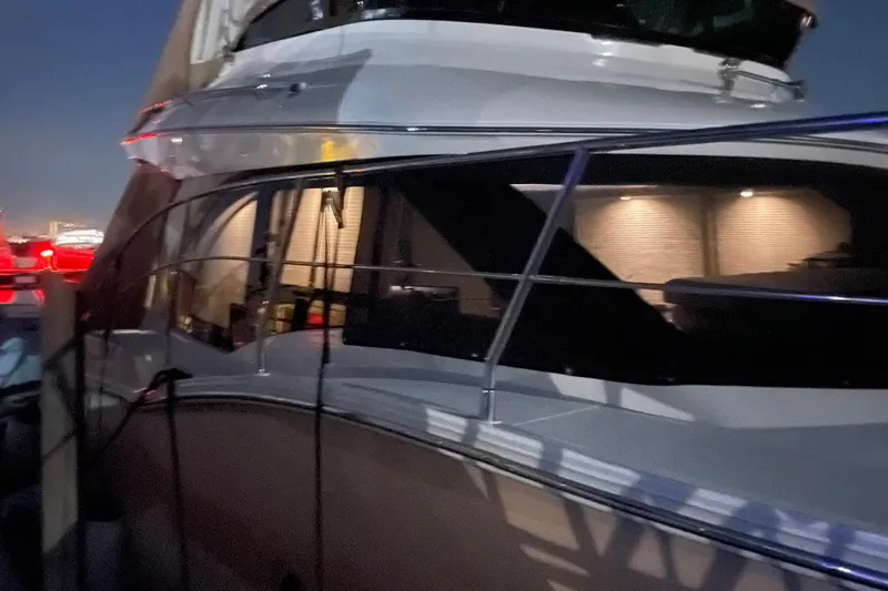 Long Gone Yacht Photos Pics 2013 Carver C34 yacht docked at night with illuminated interior.