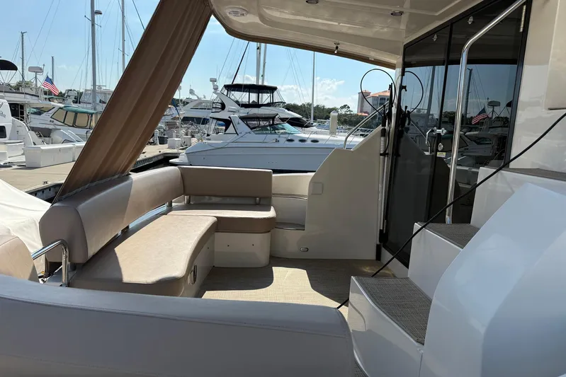 Long Gone Yacht Photos Pics 2013 Carver C34 yacht interior with seating area and marina view.