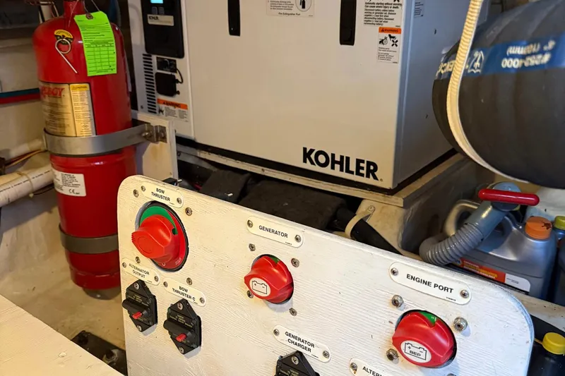 Long Gone Yacht Photos Pics Engine room of 2013 Carver C34 with Kohler generator and fire extinguisher.