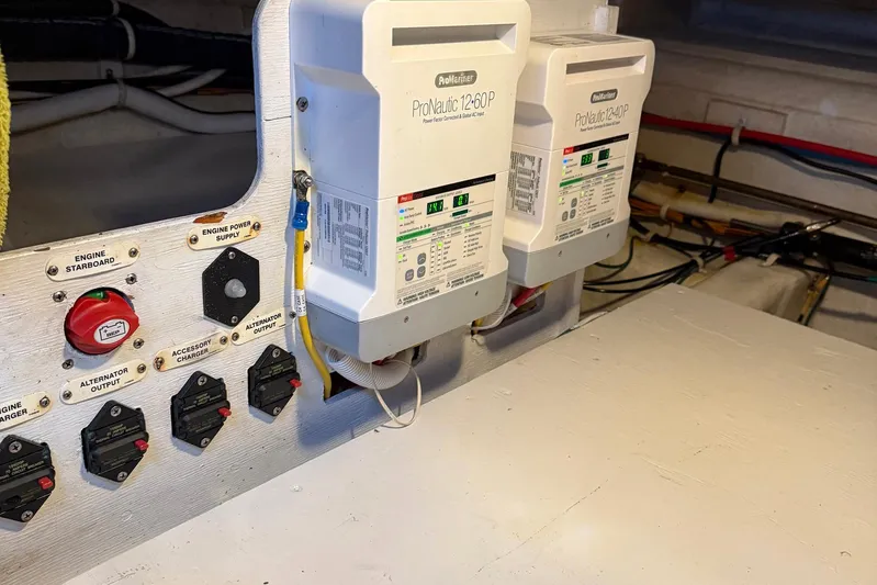 Long Gone Yacht Photos Pics Electrical panel and chargers in 2013 Carver C34 boat engine room.