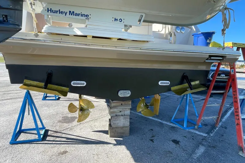 Long Gone Yacht Photos Pics 2013 Carver C34 boat on stands, showing propellers and hull details.