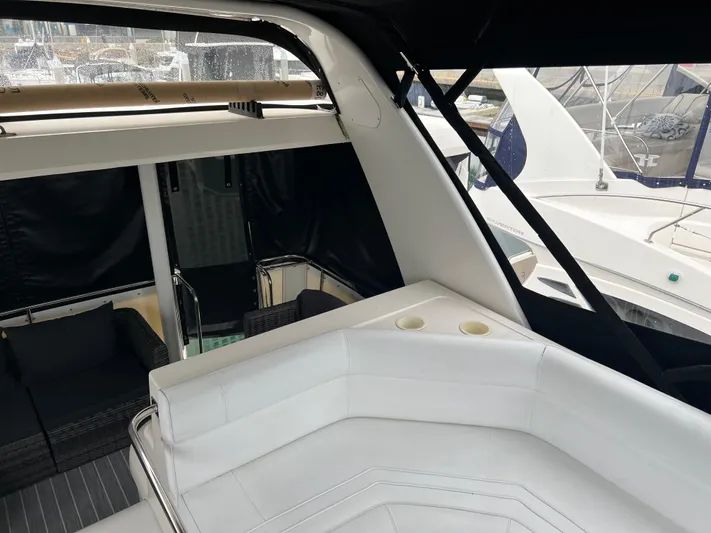 Low Engine Hours Yacht Photos Pics 1995 Cruisers Yachts 3650 ACMY with white seating and sleek design in marina setting.